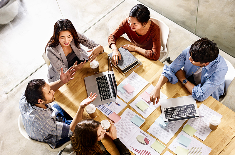 Office scene with international staff members.